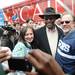 Jo Pichan and her husband David, both of Ypsilanti, pose for a photograph with Republican presidential candidate Herman Cain as he greets supporters after giving a speech at the Big Sky Diner in Ypsilanti during a stop on Thursday morning. Melanie Maxwell I AnnArbor.com